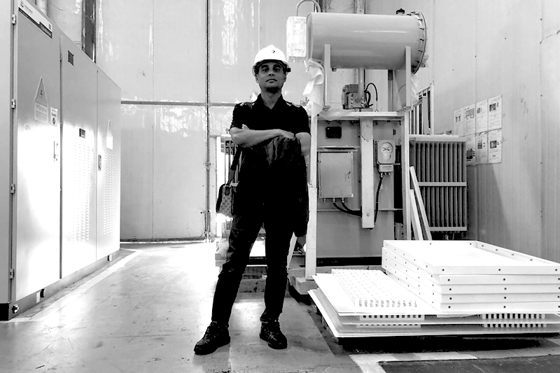 Engineer standing next to transformer